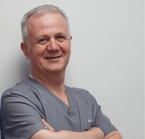 Dentist examining patient in clinic