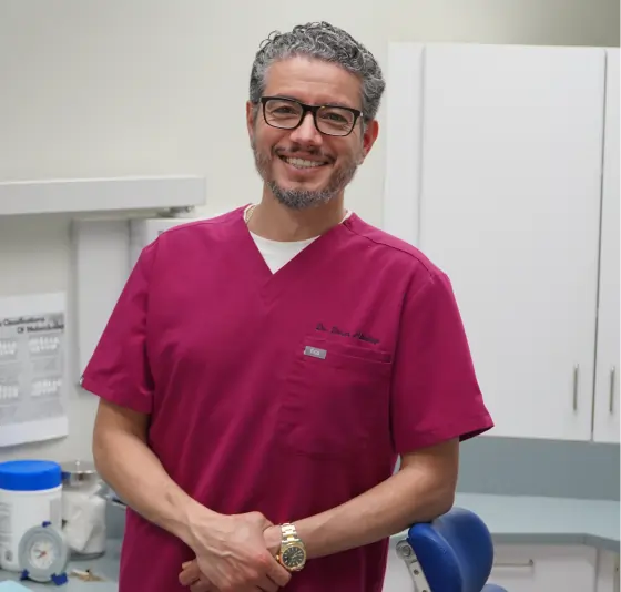 Dentist treating patient with smile